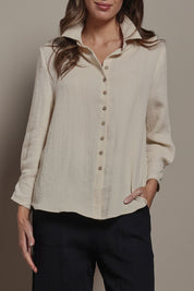 Model Madeline wearing size 10 of The Must Have Linen Look Shirt in colour Sand, from the front, cropped image