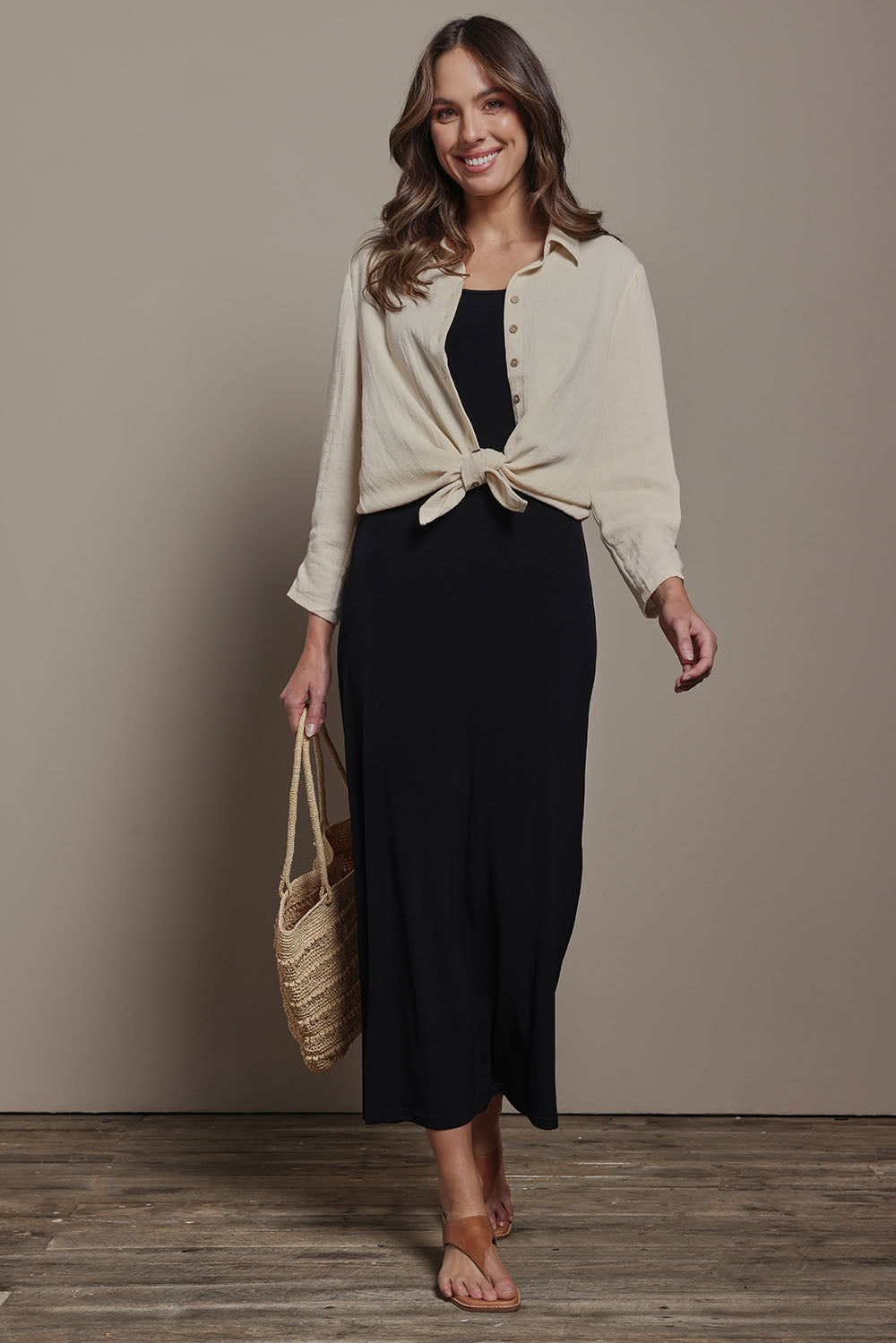 Model Madeline wearing size 10 of The Must Have Linen Look Shirt in colour Sand, from the front, showing the whole outfit