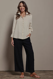 Model Madeline wearing size 10 of The Must Have Linen Look Shirt in colour Sand, from the front, showing the whole outfit