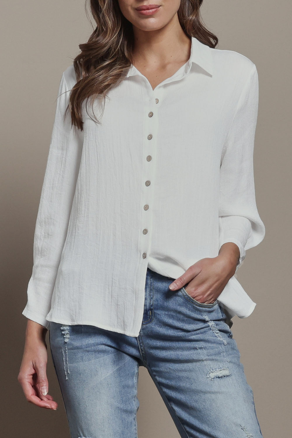 Model Madeline wearing size 10 of The Must Have Linen Look Shirt in colour White (White), from the front, cropped image