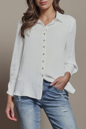 Model Madeline wearing size 10 of The Must Have Linen Look Shirt in colour White (White), from the front, cropped image