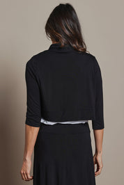 Model Amanda wearing size 10 of The Mix Me Match Me Bamboo Shrug in colour Black (Black), from the back