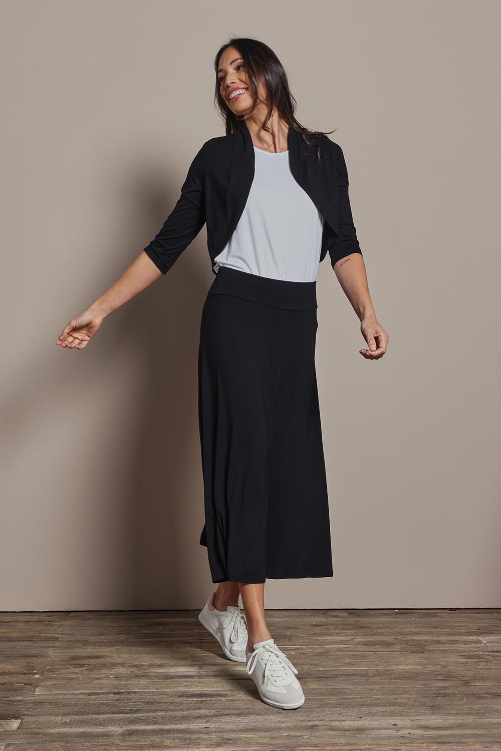 Model Amanda wearing size 10 of The Mix Me Match Me Bamboo Shrug in colour Black (Black), from the front, showing the whole outfit