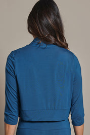 Model Amanda wearing size 10 of The Mix Me Match Me Bamboo Shrug in colour Marine (Blue), from the back