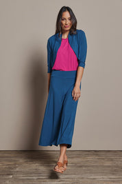 Model Amanda wearing size 10 of The Mix Me Match Me Bamboo Shrug in colour Marine (Blue), from the front, showing the whole outfit