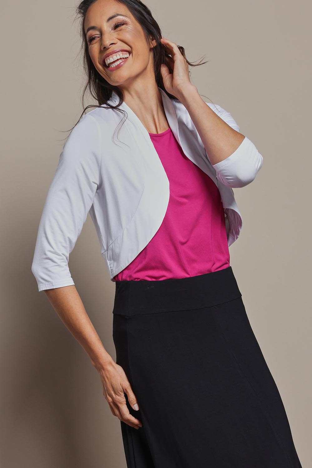 Model Amanda wearing size 10 of The Mix Me Match Me Bamboo Shrug in colour White (White), from the front, cropped image