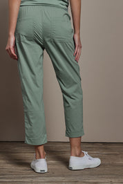 Model Madeline wearing size 10 of The Elastic Waist Pull On Patch Pocket Pant in colour Fern (Green), from the back