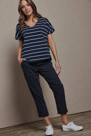 Model Madeline wearing size 10 of The Elastic Waist Pull On Patch Pocket Pant in colour Navy (Blue), from the front, showing the whole outfit