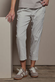 Model Madeline wearing size 10 of The Elastic Waist Pull On Patch Pocket Pant in colour Pummice, from the front, cropped image