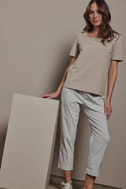 Model Madeline wearing size 10 of The Elastic Waist Pull On Patch Pocket Pant in colour Pummice, from the front, showing the whole outfit