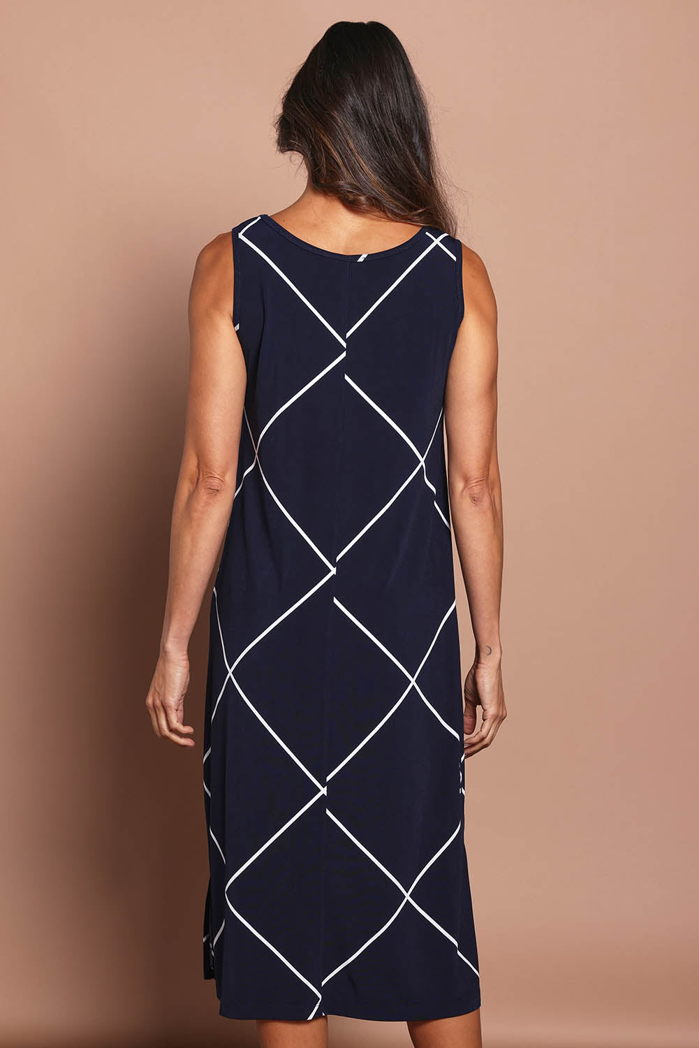 Model Amanda wearing size 10 of The Easy Wear Printed Tank Dress in colour Navywhite (Blue), from the back