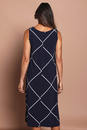 Model Amanda wearing size 10 of The Easy Wear Printed Tank Dress in colour Navywhite (Blue), from the back