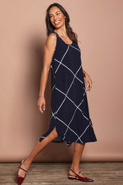 Model Amanda wearing size 10 of The Easy Wear Printed Tank Dress in colour Navywhite (Blue), from the front, showing the whole outfit