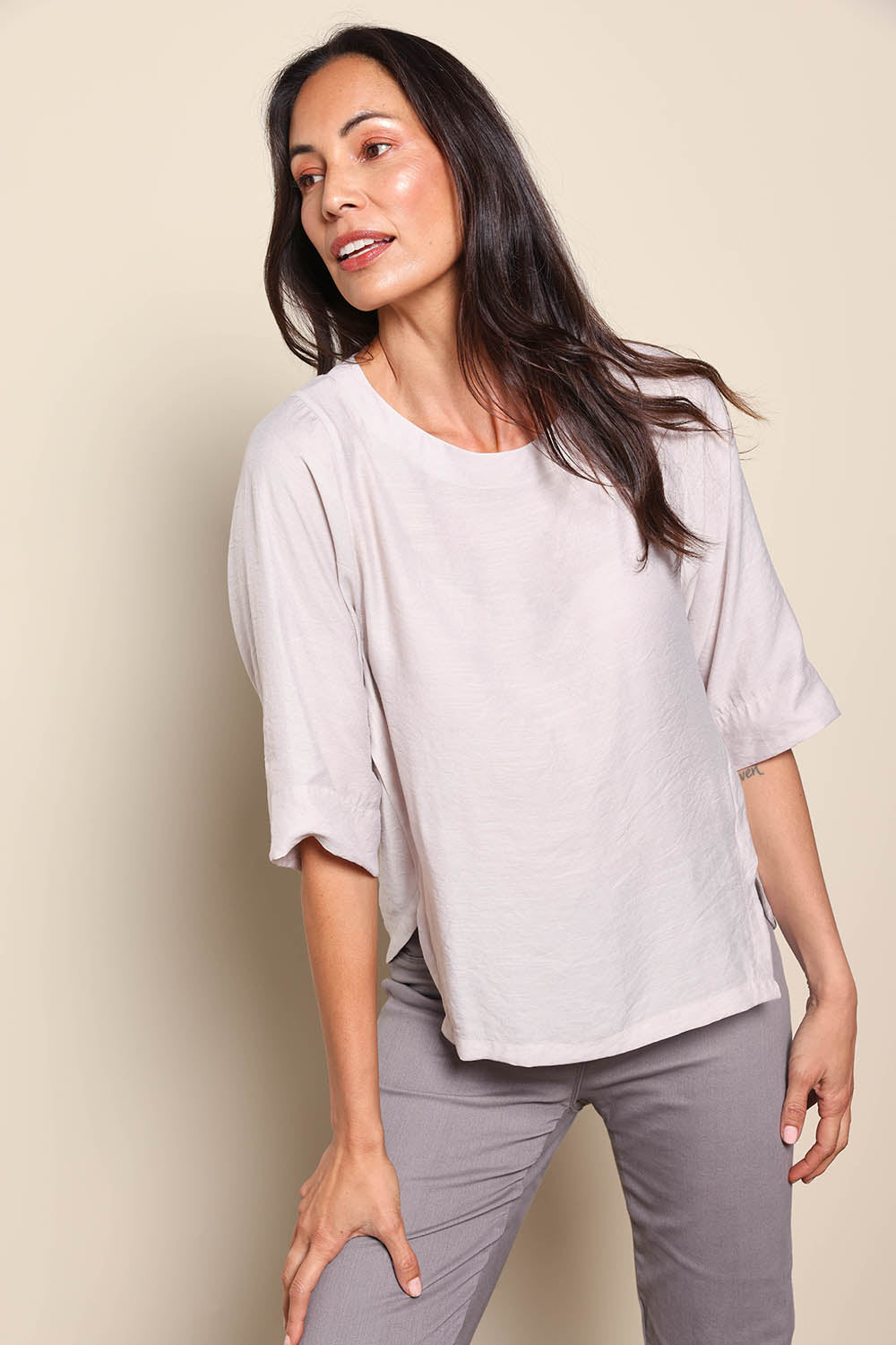 Model Amandam wearing size 10 of the The Popover Cotton Blend Boat Neck Top – Natural in colour Natural, from an angle