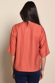 Model Amandam wearing size 10 of the The Popover Cotton Blend Boat Neck Top – Rust in colour Rust, from the back
