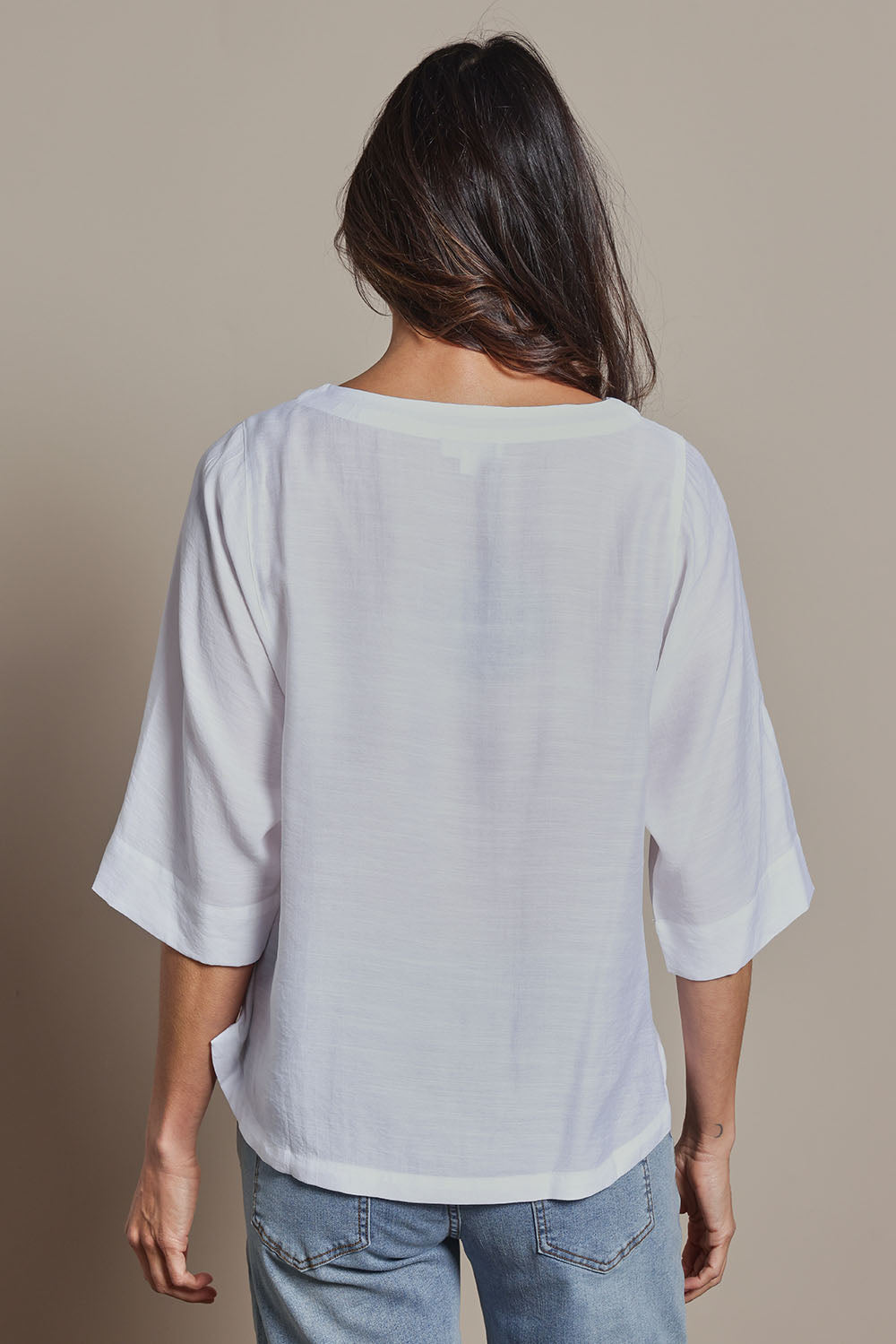 Model Amanda wearing size 10 of The Popover Cotton Blend Boat Neck Top in colour White (White), from the back