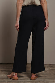 Model Madeline wearing size 10 of The Must Have Linen Look Pull on Pant in colour Black (Black), from the back