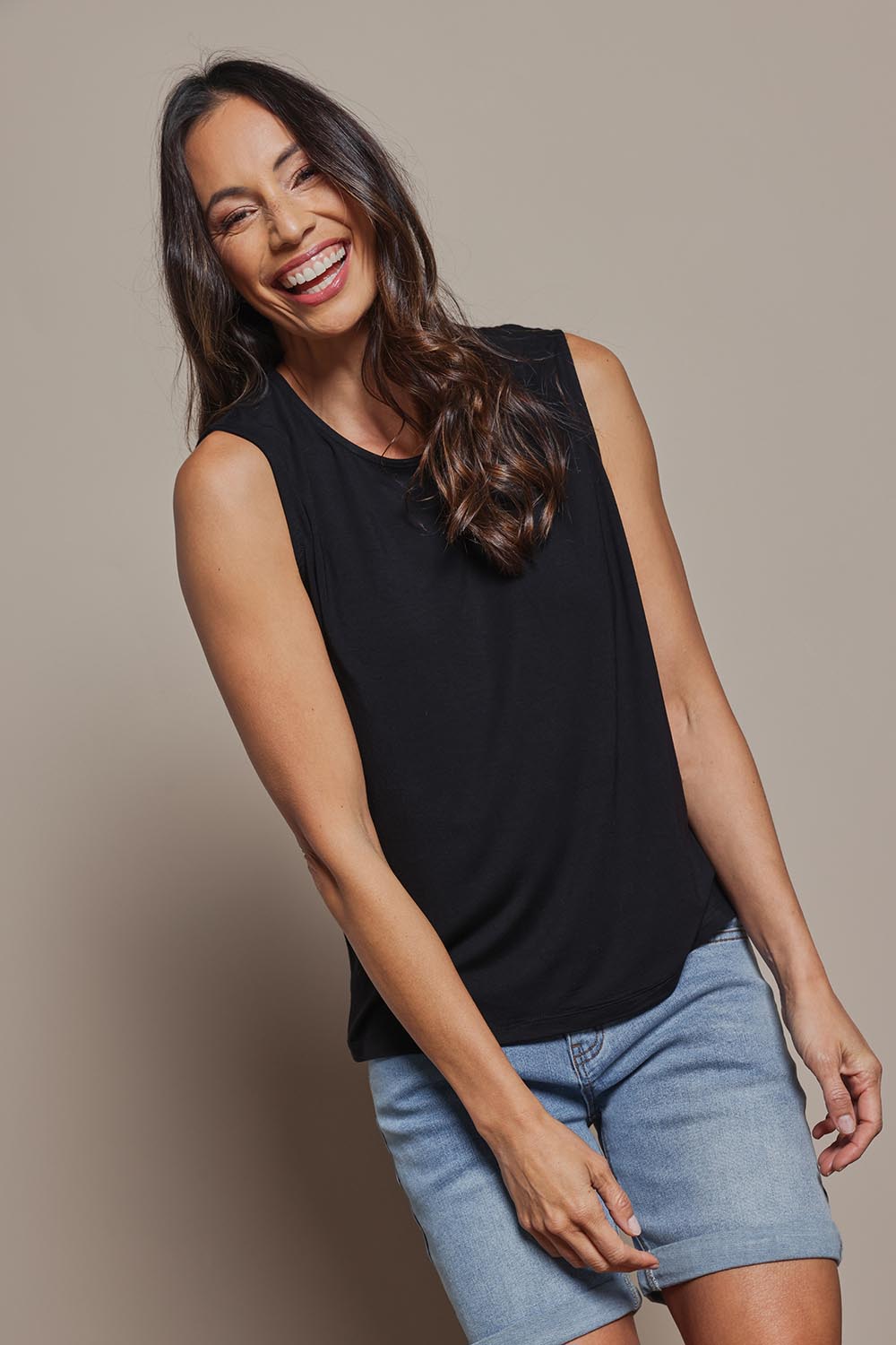 Model Amanda wearing size 10 of The Mix Me Match Me Bamboo Tank in colour Black (Black), from the front, cropped image