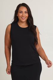 Model Ashleigh wearing size 16 of The Mix Me Match Me Bamboo Tank in colour Black (Black), from the front, cropped image