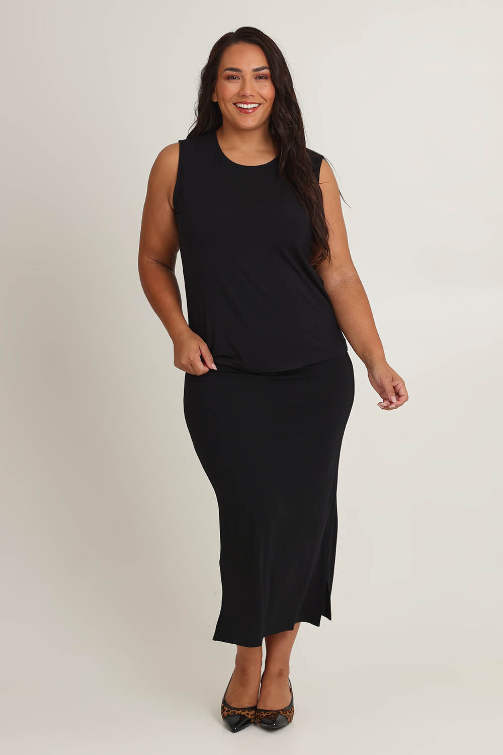 Model Ashleigh wearing size 16 of The Mix Me Match Me Bamboo Tank in colour Black (Black), from the front, showing the whole outfit