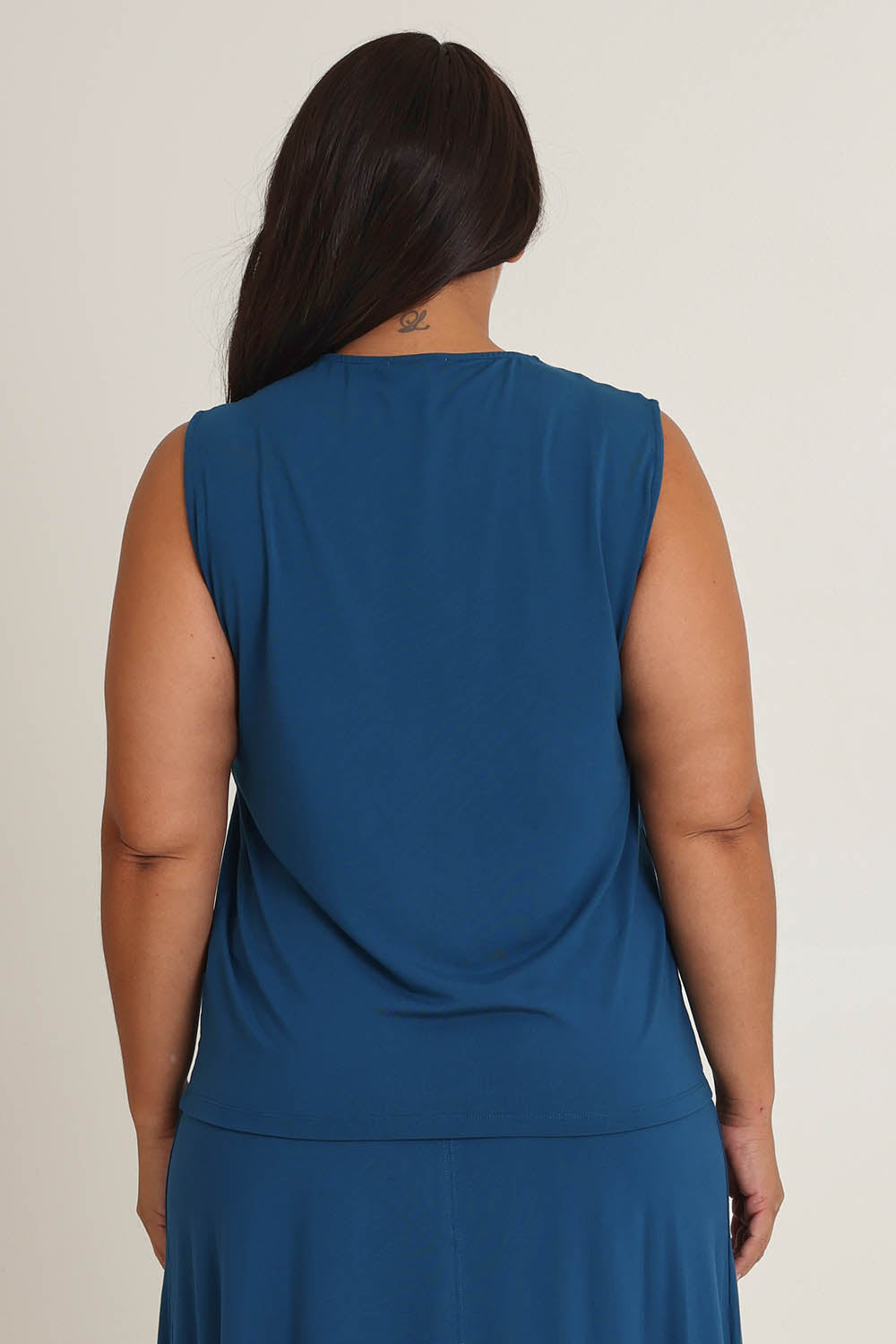 Model Ashleigh wearing size 16 of The Mix Me Match Me Bamboo Tank in colour Marine (Blue), from the back