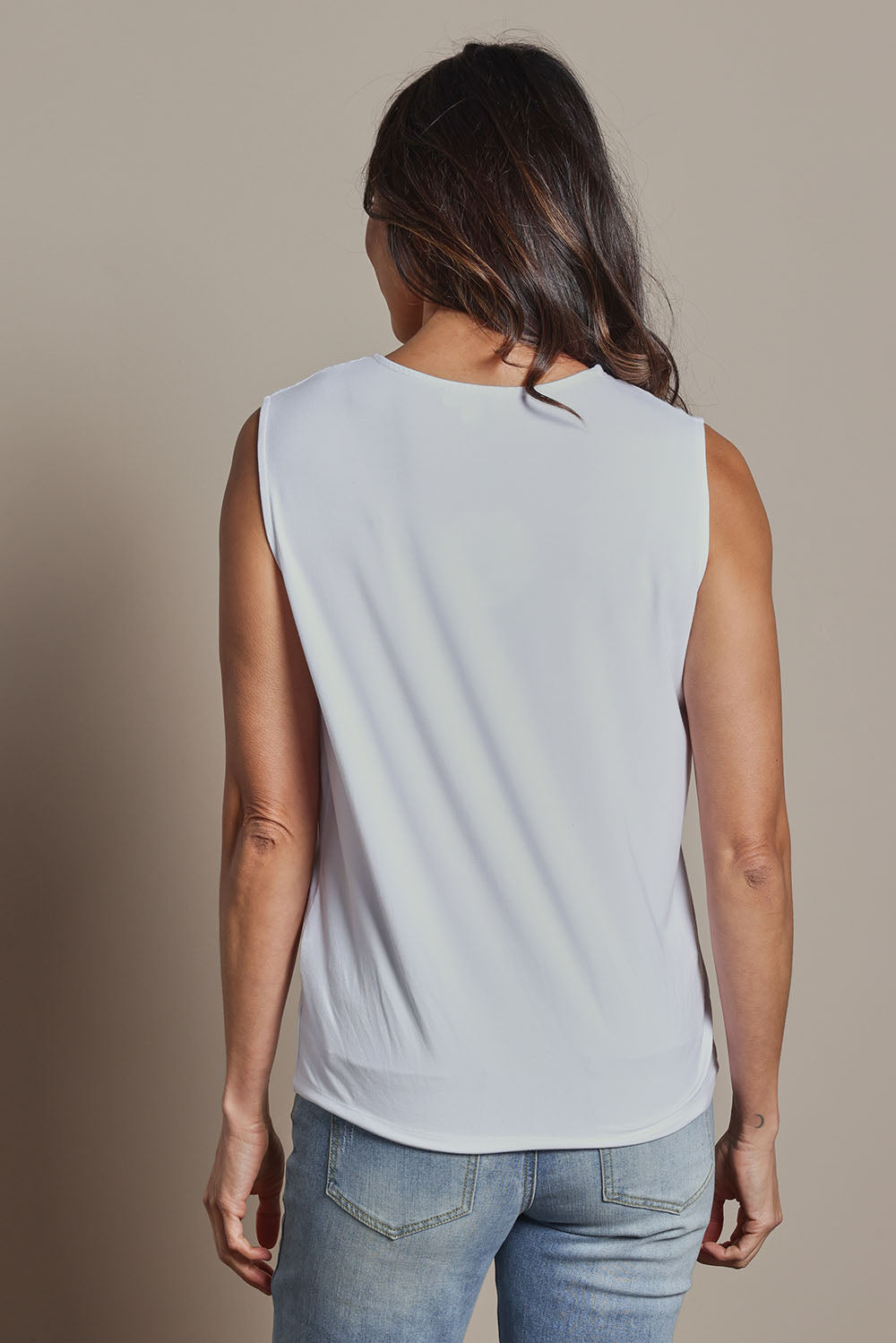 Model Amanda wearing size 10 of The Mix Me Match Me Bamboo Tank in colour White (White), from the back