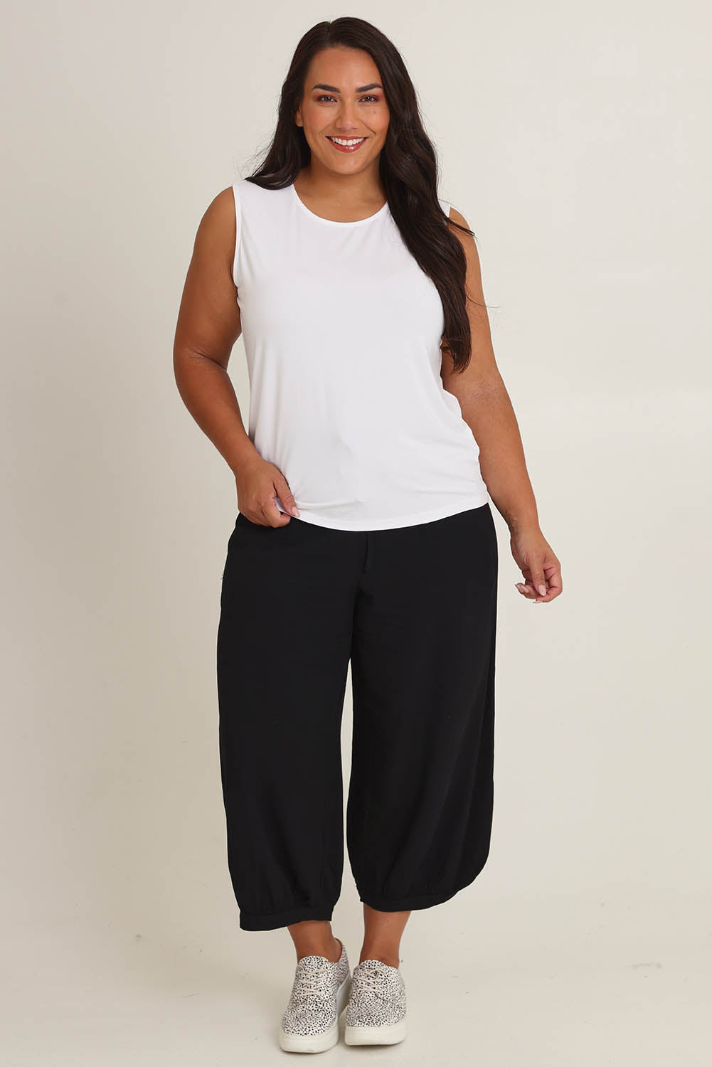 Model Ashleigh wearing size 16 of The Mix Me Match Me Bamboo Tank in colour White (White), from the front, showing the whole outfit