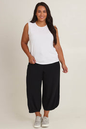 Model Ashleigh wearing size 16 of The Mix Me Match Me Bamboo Tank in colour White (White), from the front, showing the whole outfit