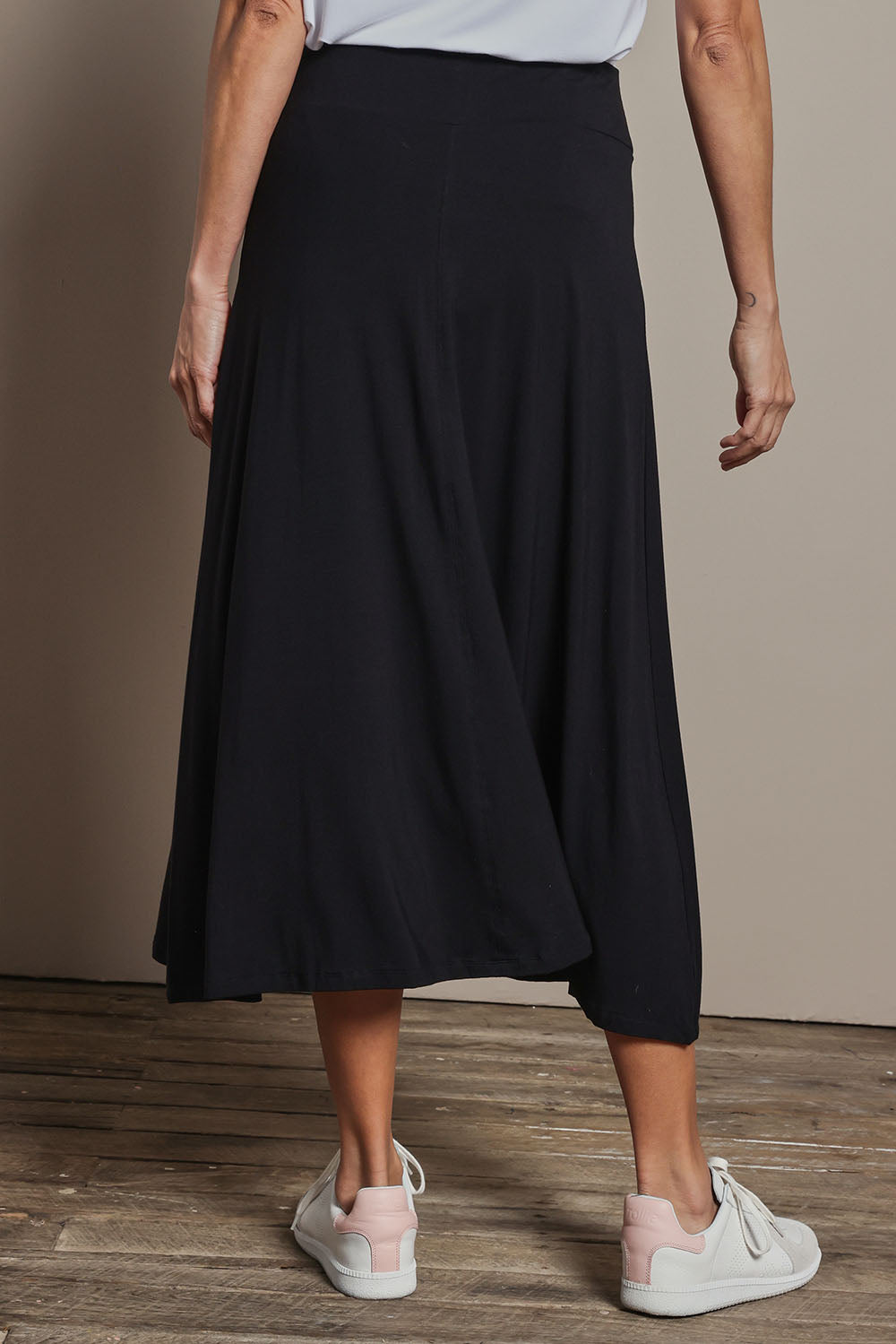Model Amanda wearing size 10 of The Mix Me Match Me Bamboo Full Skirt in colour Black (Black), from the back