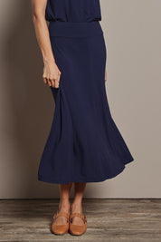 Model Amanda wearing size 10 of The Mix Me Match Me Bamboo Full Skirt in colour Darknavy (Blue), from the front, cropped image