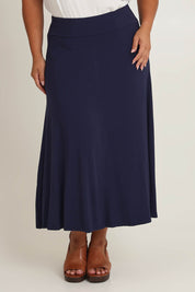 Model Ashleigh wearing size 16 of The Mix Me Match Me Bamboo Full Skirt in colour Darknavy (Blue), from the front, cropped image