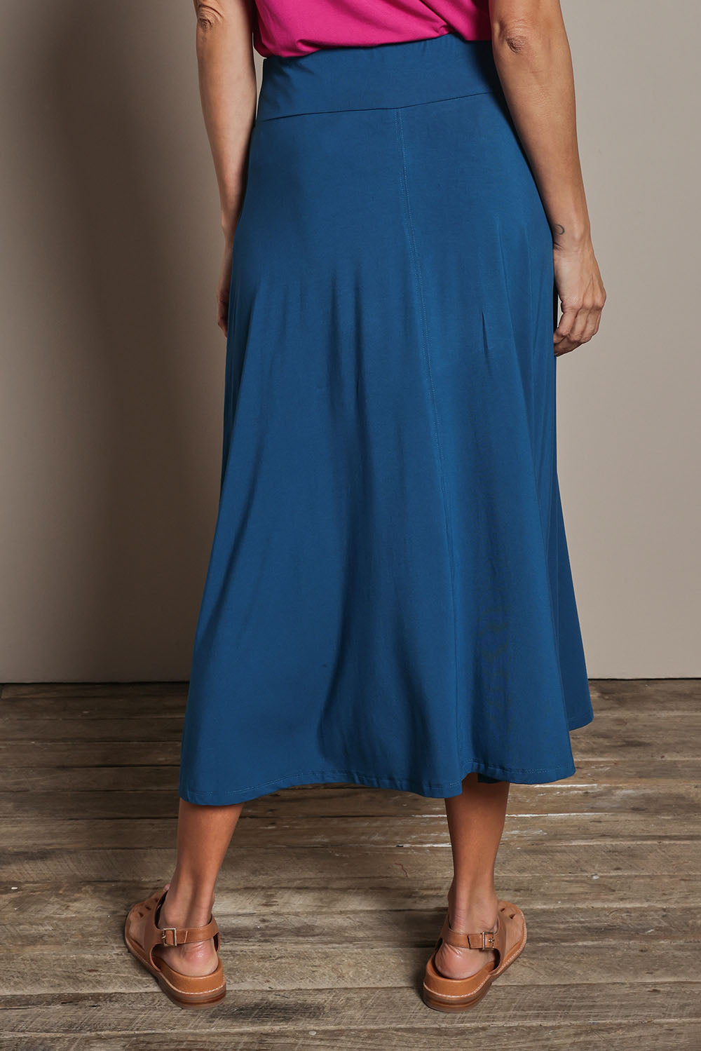 Model Amanda wearing size 10 of The Mix Me Match Me Bamboo Full Skirt in colour Marine (Blue), from the back