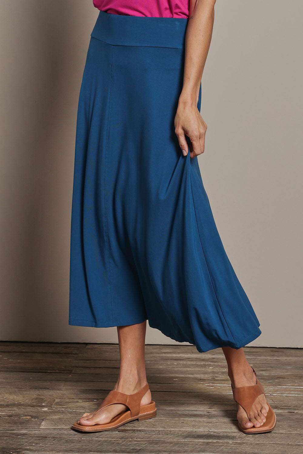 Model Amanda wearing size 10 of The Mix Me Match Me Bamboo Full Skirt in colour Marine (Blue), from the front, cropped image