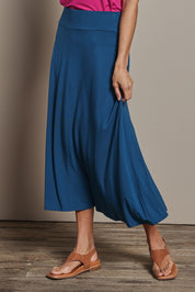 Model Amanda wearing size 10 of The Mix Me Match Me Bamboo Full Skirt in colour Marine (Blue), from the front, cropped image