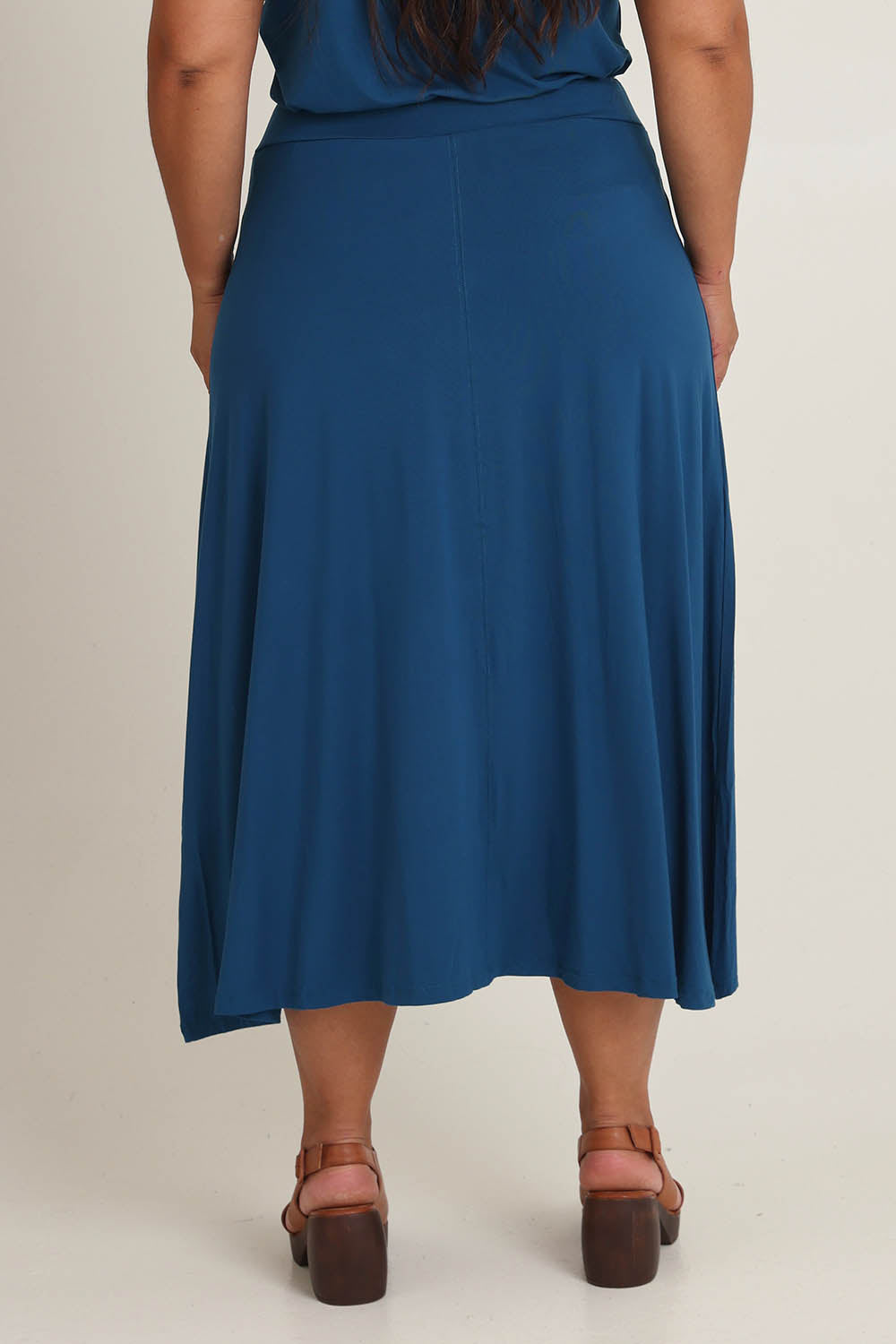 Model Ashleigh wearing size 16 of The Mix Me Match Me Bamboo Full Skirt in colour Marine (Blue), from the back