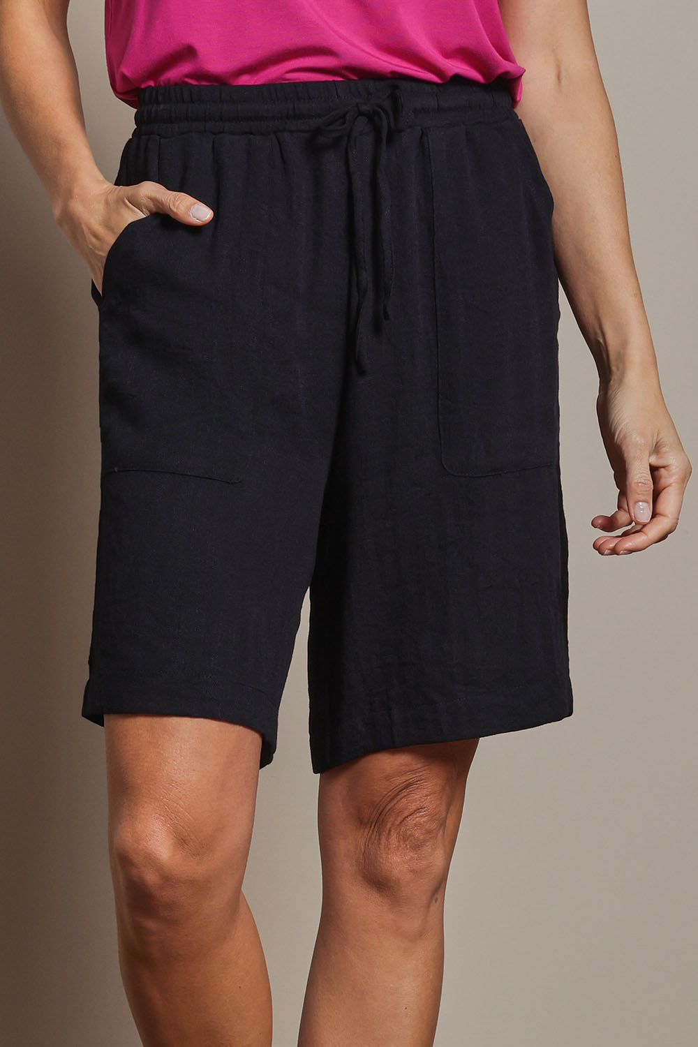 Model Amanda wearing size 10 of The Must Have Linen Look Pull On Shorts in colour Black (Black), from the front, cropped image