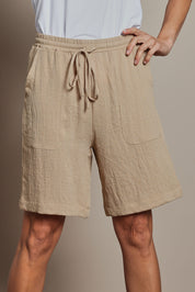 Model Amanda wearing size 10 of The Must Have Linen Look Pull On Shorts in colour Naturals, from the front, cropped image