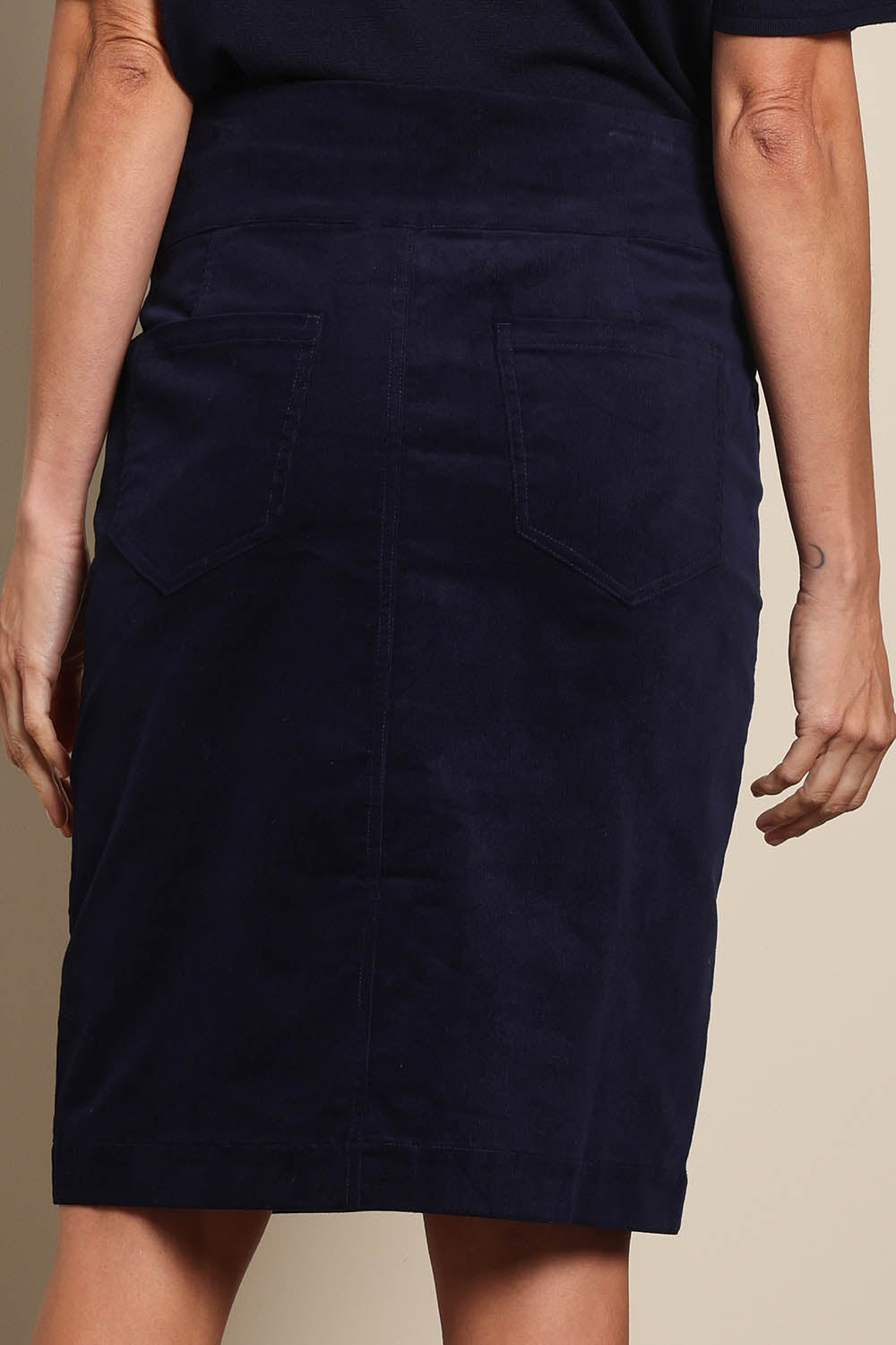 Model Amandam wearing size 10 of the The Keepers Cord Pull On Skirt – Darknavy in colour Darknavy, from the back