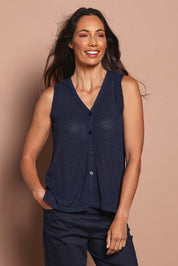 Model Amanda wearing size S of The Every Wear Knit Button Up Vest in colour Honorblue (Blue), from the front, cropped image
