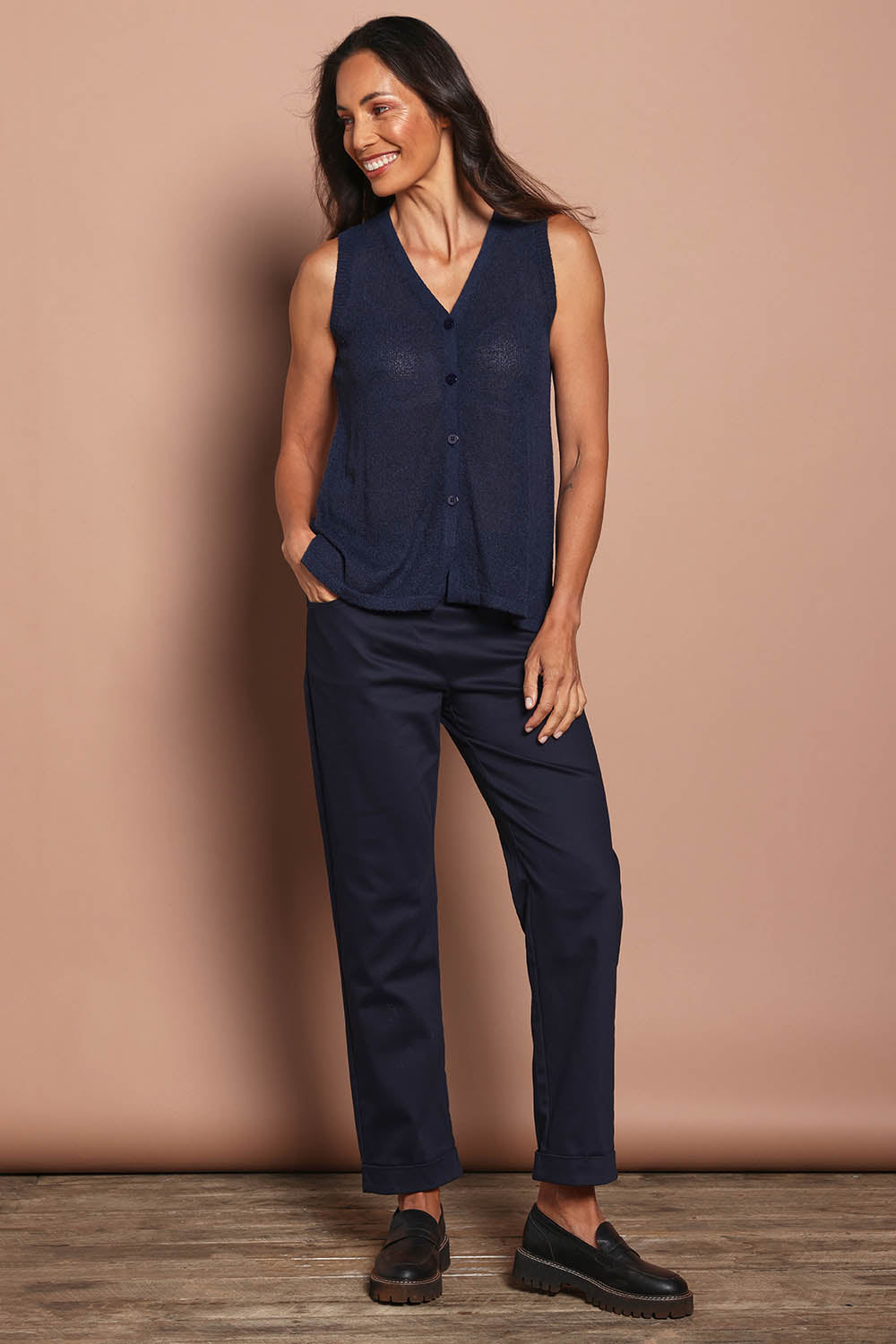 Model Amanda wearing size S of The Every Wear Knit Button Up Vest in colour Honorblue (Blue), from the front, showing the whole outfit