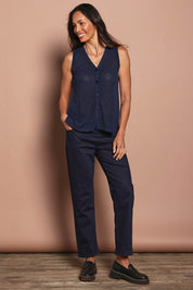 Model Amanda wearing size S of The Every Wear Knit Button Up Vest in colour Honorblue (Blue), from the front, showing the whole outfit