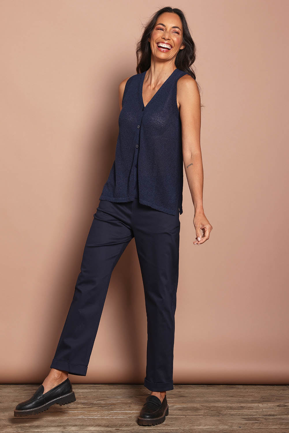 Model Amanda wearing size S of The Every Wear Knit Button Up Vest in colour Honorblue (Blue), from the front, showing the whole outfit