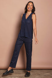 Model Amanda wearing size S of The Every Wear Knit Button Up Vest in colour Honorblue (Blue), from the front, showing the whole outfit