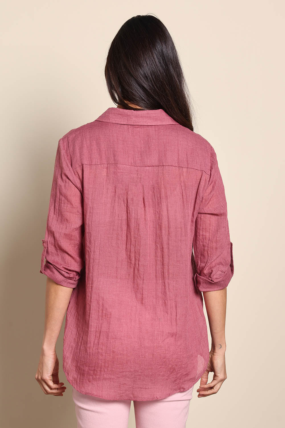 Model Amandam wearing size 10 of the The Go To Comfort Shirt - Dusty rose in colour Dusty Rose, from the back
