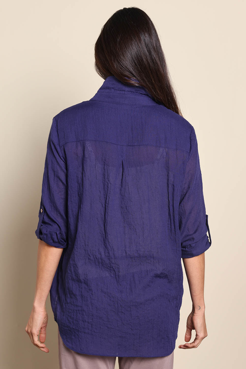 Model Amandam wearing size 10 of the The Go To Comfort Shirt - Navy in colour Navy, from the back