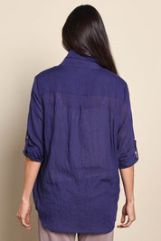 Model Amandam wearing size 10 of the The Go To Comfort Shirt - Navy in colour Navy, from the back