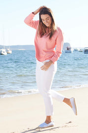 Model Laura wearing size 12 of The Relaxed Henley Tee in colour Coral (Pink), from the front, showing the whole outfit