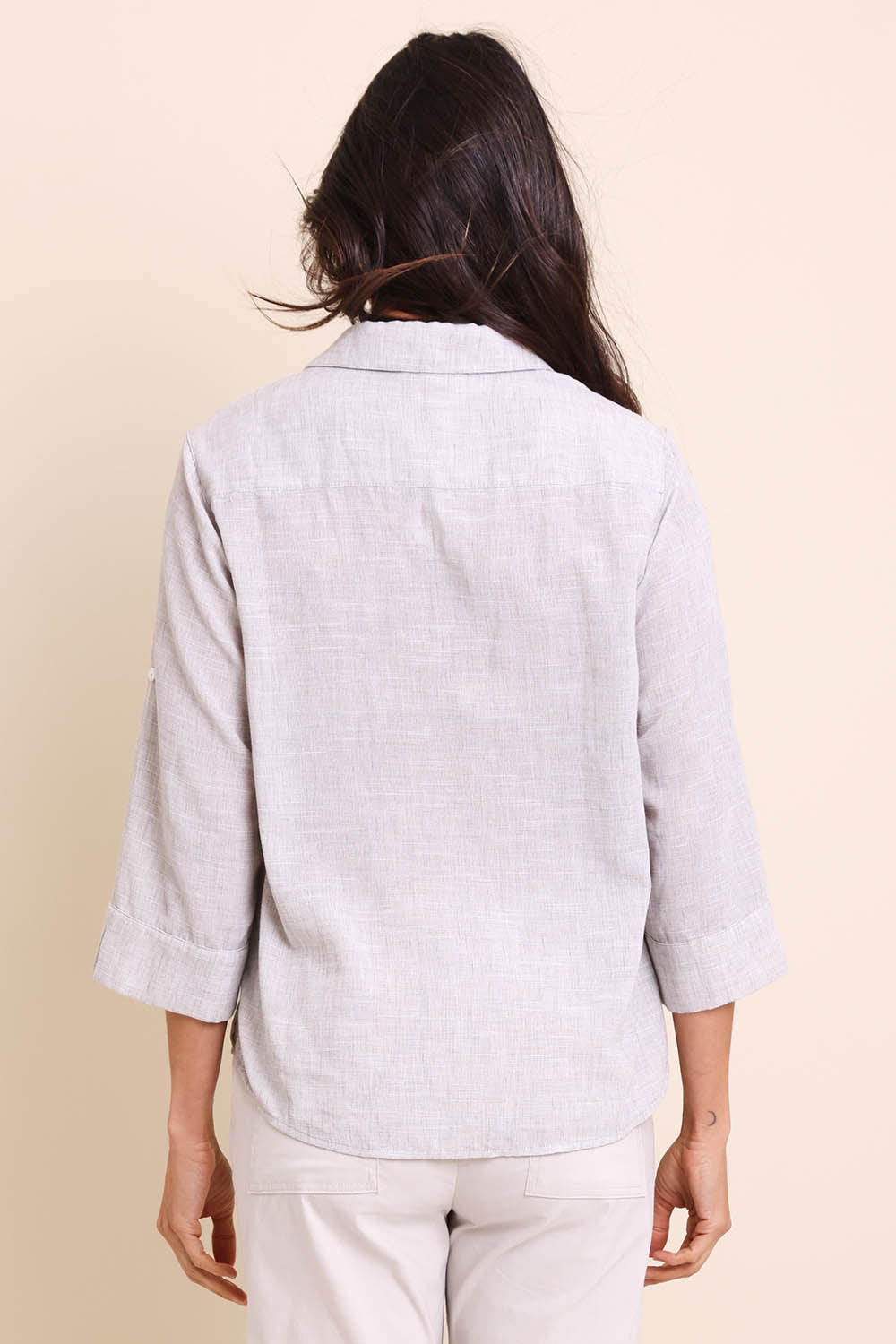 Model Amandam wearing size 10 of the The Easy Wear Shirt  - Oyster in colour Oyster, from the back