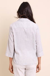 Model Amandam wearing size 10 of the The Easy Wear Shirt  - Oyster in colour Oyster, from the back