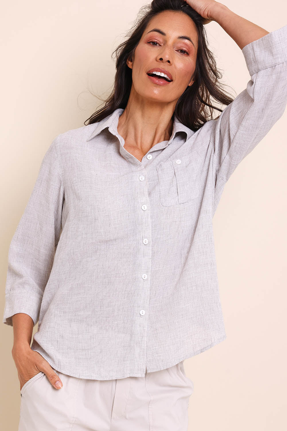 Model Amandam wearing size 10 of the The Easy Wear Shirt  - Oyster in colour Oyster, in a cropped view